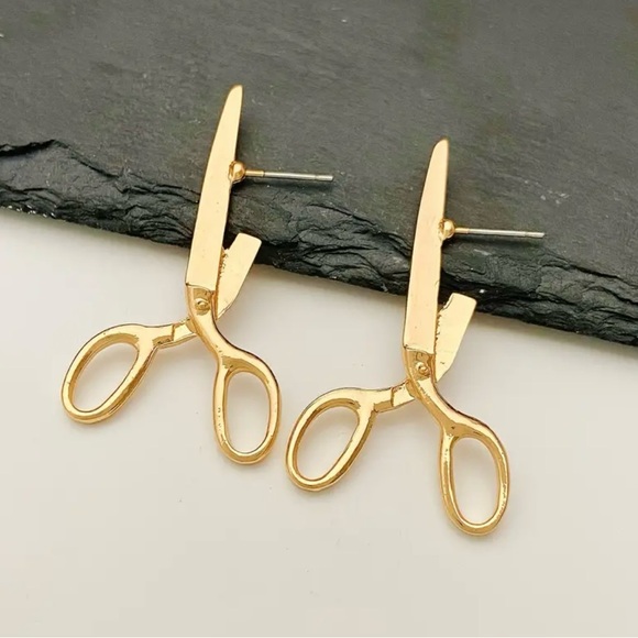 Punk inspired scissors gold tone earrings.
Alloy material - Picture 1 of 3